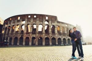 two-people-standing-near-coliseum-rome_1304-4859